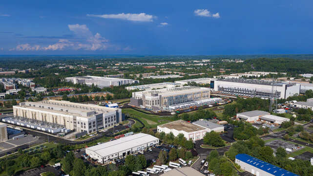 Large data center campus buildings under construction aerial view in Virginia