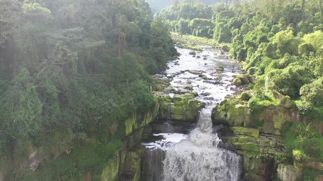 Aerial reveal of Tequendama Falls and rocky river in Colombia