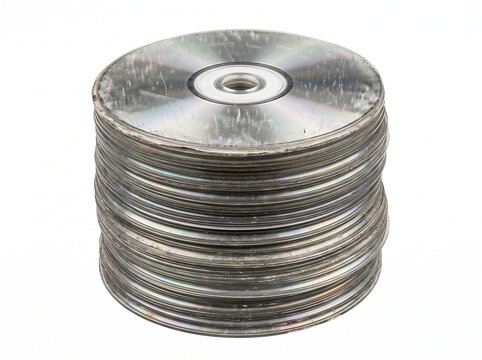 Stack of old scratched CDs and DVDs on a white background representing obsolete data storage technology