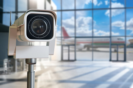 Airport security. CCTV surveillance camera monitors airport terminal and aircraft operations, supporting aviation security, passenger safety, perimeter protection and remote monitoring.