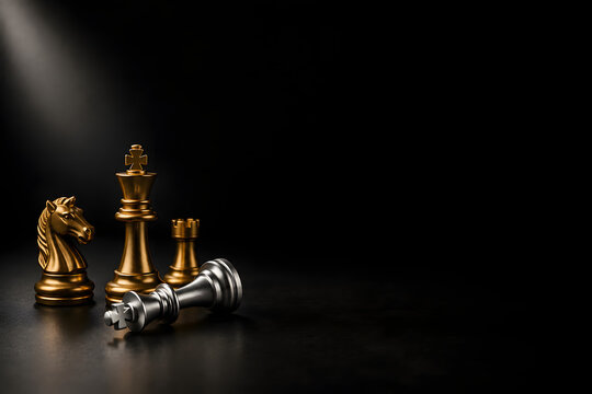 Gold and silver chess pieces on black background representing business strategy and victory