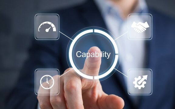 Business person touching a digital interface screen with a capability concept