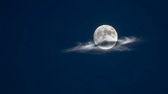 Detailed full moon resting on a soft wispy cirrus cloud in a deep blue night sky, creating a serene, astronomical, and dreamy background atmosphere.