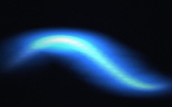 Dynamic glowing blue streak with a bright core against a dark black background