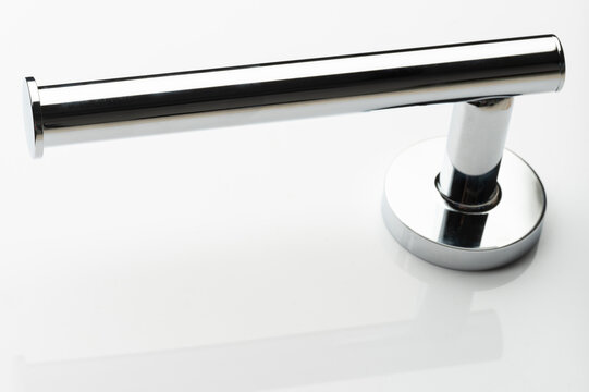 Metal handle on a white surface in a bright setting