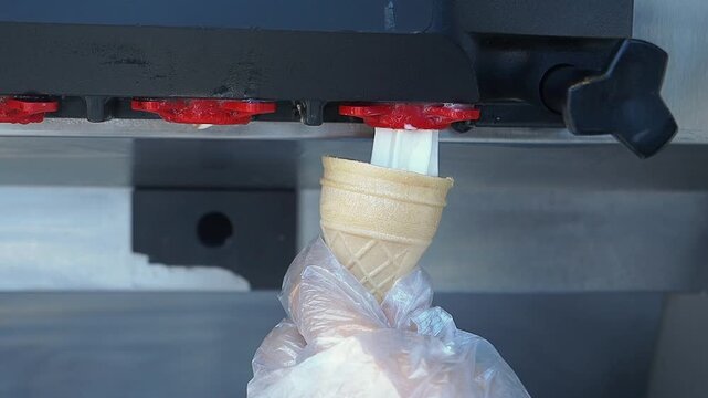 Making ice cream cones at a shop in summer