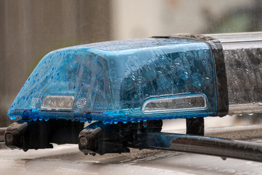 emergency lightbar covered with rain drops