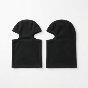 Black fleece balaclavas laid flat on neutral background