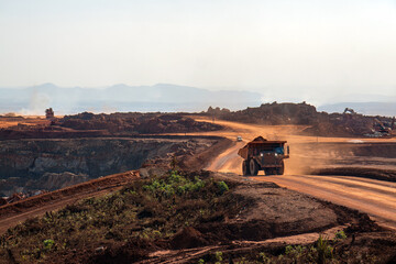 Heavy Mining Dump Truck Hauling Ore Through Open Pit Mine © William