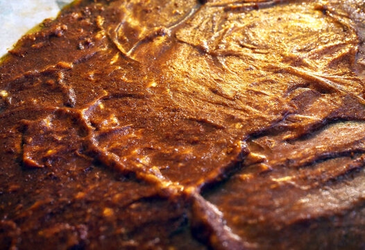 Closeup texture of perfectly cooked roasted meat with crispy browned surface ready to serve