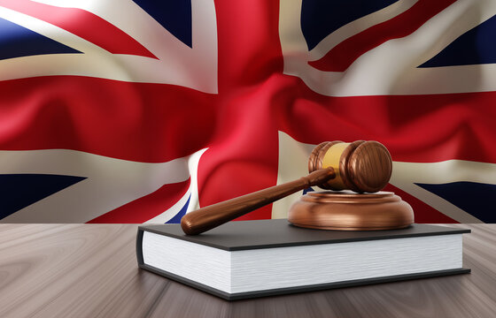Judge's gavel with book on background of Great Britain flag