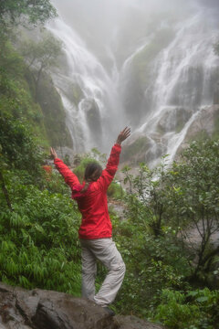 Hiker asian happy feeling freedom good and strong weight victorious facing on the natural mountain. Travel Concept