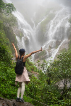 Hiker asian happy feeling freedom good and strong weight victorious facing on the natural mountain. Travel Concept