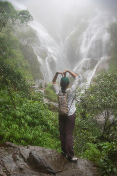 Hiker asian happy feeling freedom good and strong weight victorious facing on the natural mountain. Travel Concept