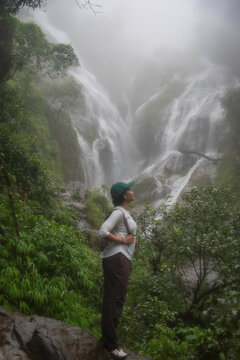 Hiker asian happy feeling freedom good and strong weight victorious facing on the natural mountain. Travel Concept