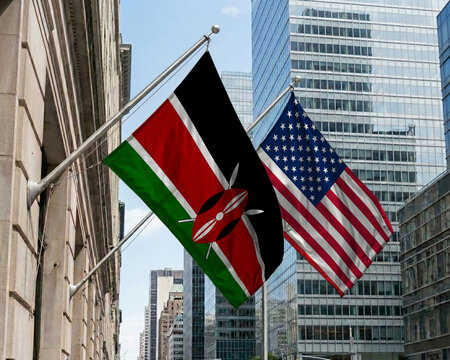 Kenya and United States crossed national flags waving against a blue sky, representing bilateral relations and diplomacy.