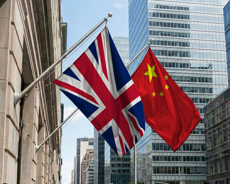United Kingdom and China crossed national flags waving against a blue sky, representing bilateral relations and diplomacy. 3D illustration.