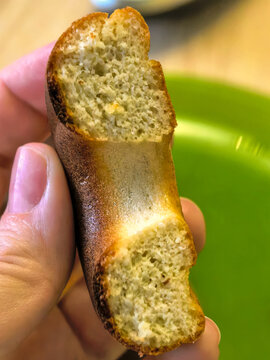 Bitten Homemade Keto Donut Close Up in Hand