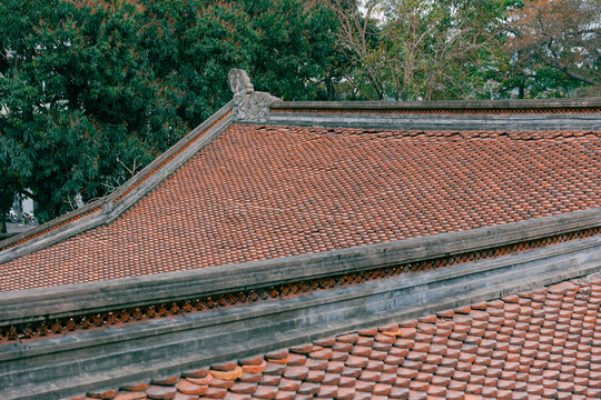Traditional tiled roof of an ancient building in Hanoi, Vietnam