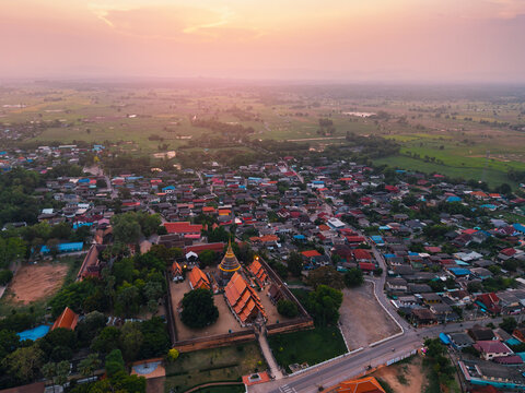 Wat Phra That Lampang on sunset. Aerial view Buddhist temple complex in Thailand.