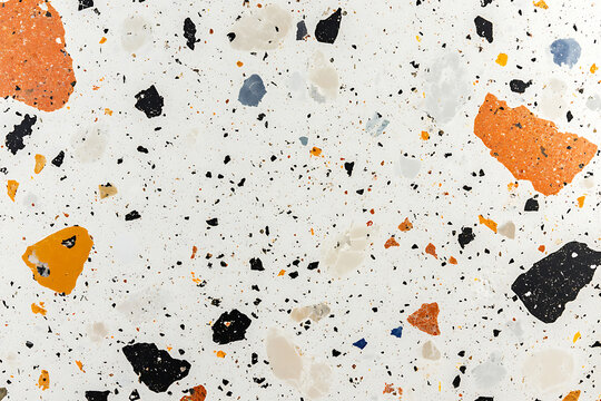 Abstract terrazzo pattern with orange and black specks and modern texture.