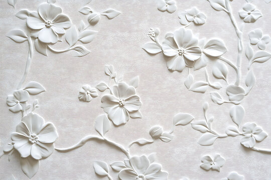 White floral relief with delicate branches and blossoms.