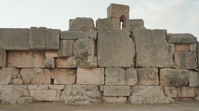 massive ancient stone wall structure at baalbek ruins
