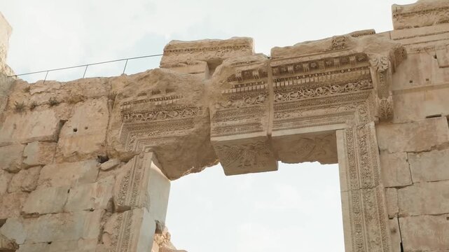 intricate carved stone doorway ruins at temple of bacchus