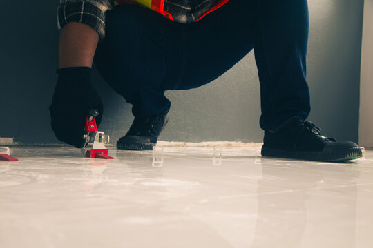 Technicians use Tile leveling pliers Leveling wedges Tile leveling clips to lay tiles.
