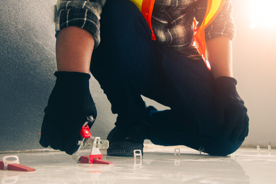 Technicians use Tile leveling pliers Leveling wedges Tile leveling clips to lay tiles.