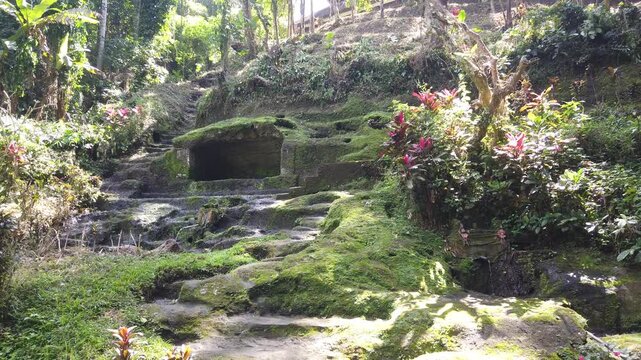 Panning View Mossy Ancient Rock Carvings Jungle Valley Goa Gajah Temple Bali Indonesia Landscape