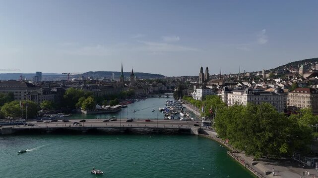 Forward drone above bridge beside opera into river entrance