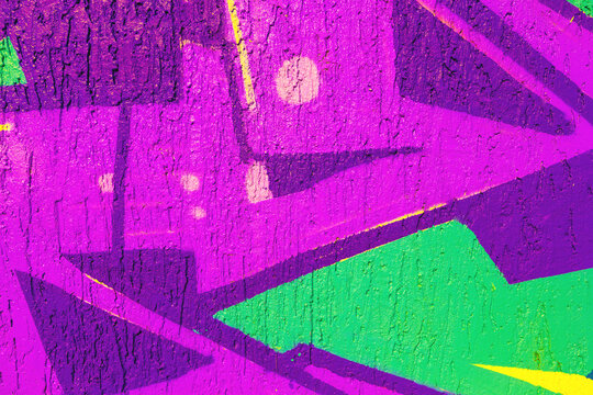 Abstract graffiti art with purple, green, yellow colors. Neon 80s style, fluorescent glow, bold geometric shapes. Urban wall texture, street art, digital art, creative banner, summer visuals.