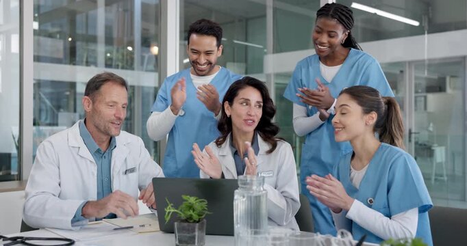 Laptop, people or applause with medical team in hospital, wellness breakthrough or surgery success. Happy doctors, nurses or clap in clinic for healthcare goal, high five or fist pump with computer