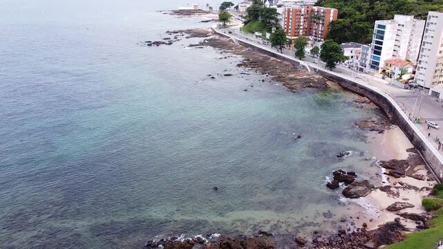 Drone footage Aerial view rocky beach coastline, Av. Sete de Setembro, Praia Do Espanhol, Salvador, Bahia state | Brasil