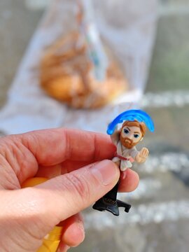 Rome, Italy - May 10, 2026, detail of a collector with a model from the Star Wars Kinder series (Obi-Wan Kenobi), a special collection of officially licensed Disney surprises.