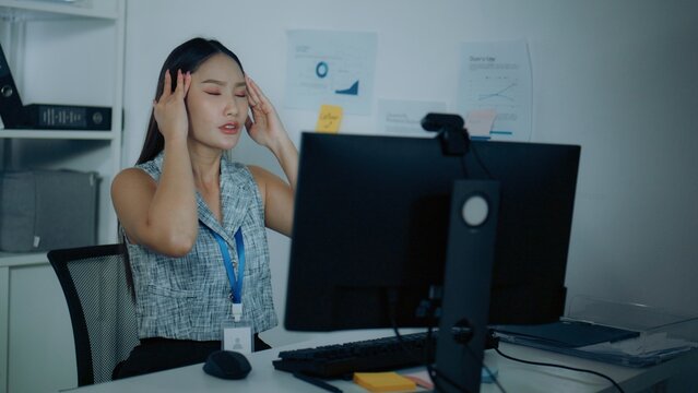 headache head ache with office syndrome; a worker with a headache. headache guides buyer choices, head frames the scene, and ache adds useful meaning. Clear visual context supports stock buyers.