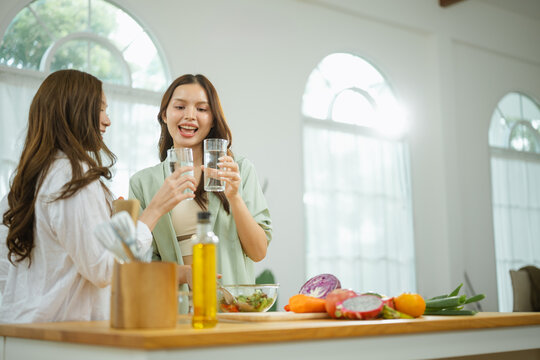 drinking water hydration with healthy lifestyle; friends drinking water. drinking guides buyer choices, water frames the scene, and hydration adds useful meaning. In a clear visual scene.