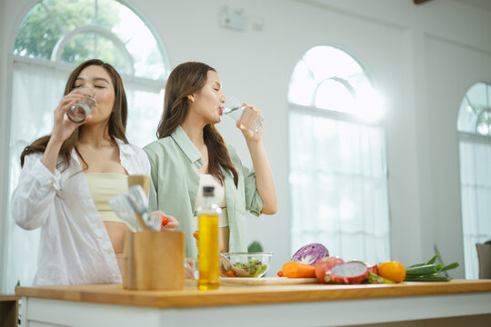 drinking water hydration with healthy wellness; friends drinking water. drinking guides buyer choices, water frames the scene, and hydration adds useful meaning. In a clear visual scene.