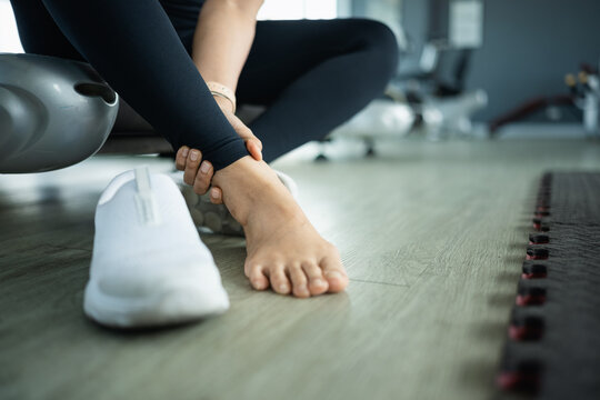 ankle pain injury with strain soreness; an athlete with ankle pain. ankle guides buyer choices, pain frames the scene, and injury adds useful meaning. Clear visual context supports stock buyers.