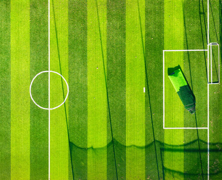 Aerial view of a football field with green grass and white markings in Novi Sad, Vojvodina, Serbia.