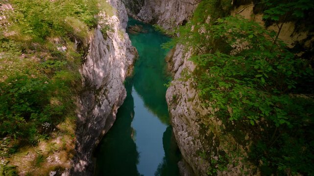 Sentiero del Dint view of the narrow Cellina gorge with emerald green water and limestone walls, Italy