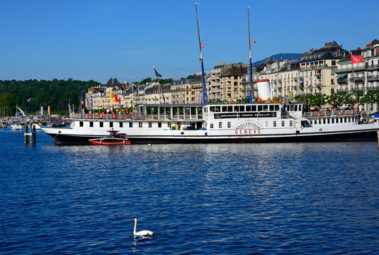 Geneva, Switzerland, Europe - 05.2022 : MS Gen&egrave;ve - oldest paddle ship of Lake Geneva, presently unserviceable but still aflot moored at Eaux-Vives dock, used as restaurant - Buvette du Bateau
