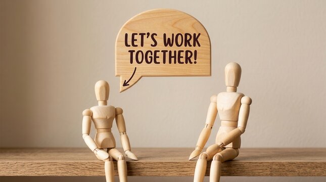 Wooden Figures Engaged in Dialogue with Speech Bubble on Plain Beige Background