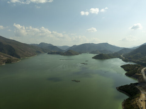 Aerial view of the Rio Balsas reservoir surrounded by mountains and sparse vegetation in Infiernillo, Michoacan, Mexico.