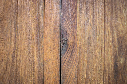 Natural brown wooden planks texture background with wood knot.