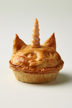 Golden Pastry Pie Shaped Like a Cat With Unicorn Horn