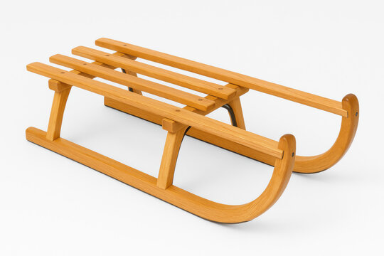 Classic wooden sleigh isolated on white background with smooth curved runners and slatted seat, perfect for winter holiday fun and traditional outdoor snow activities