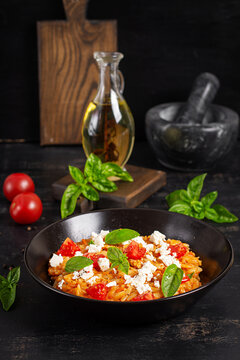Authentic Greek Kritharaki Dish with Tomatoes and Basil