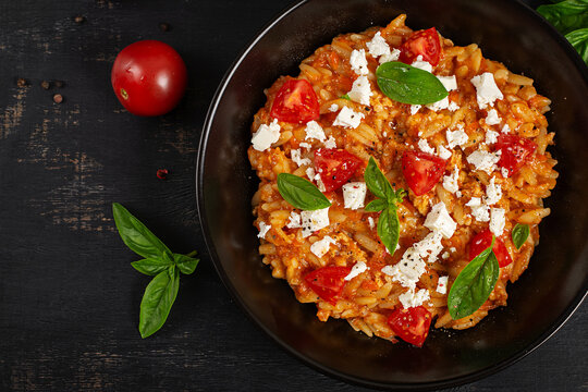 Mediterranean Kritharoto with Cherry Tomatoes and Basil Top View
